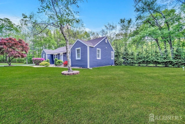 15 Federal Rd, Monroe, NJ 08831 - view of side of home with a yard and a shingled roof