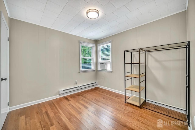 15 Federal Rd, Monroe, NJ 08831 - unfurnished bedroom with baseboard heating, light wood finished floors, baseboards, and cooling unit