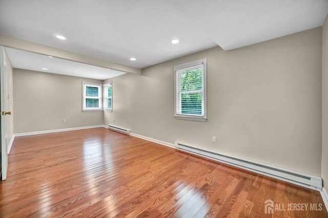 15 Federal Rd, Monroe, NJ 08831 - empty room with a baseboard heating unit, healthy amount of natural light, light wood-style flooring, and recessed lighting