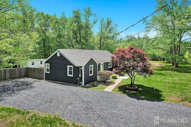 15 Federal Rd, Monroe, NJ 08831 - view of front of house with a chimney, driveway, and roof with shingles