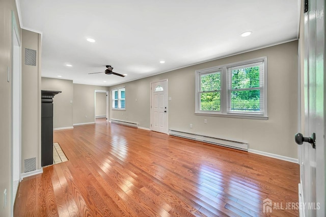15 Federal Rd, Monroe, NJ 08831 - unfurnished living room with a baseboard heating unit, light wood-type flooring, ceiling fan, baseboards, and recessed lighting