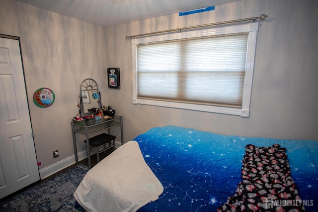 bedroom featuring baseboards