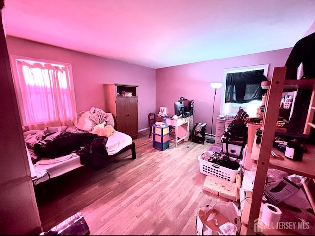 bedroom with wood finished floors