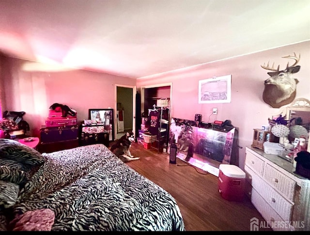 bedroom with wood finished floors