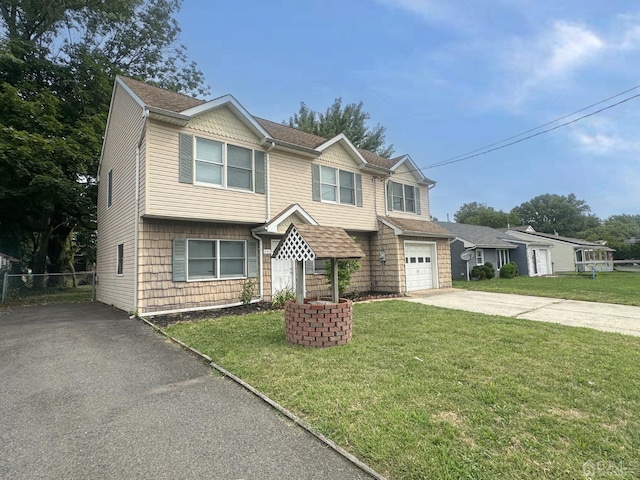 view of front facade featuring a front yard and a garage