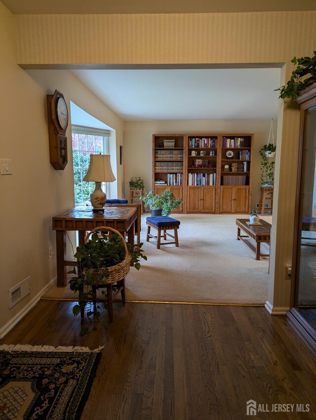 corridor with dark hardwood / wood-style floors