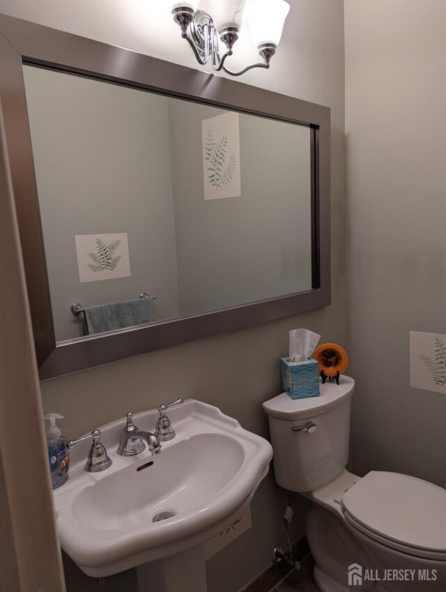 bathroom with sink and toilet