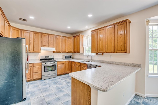 2 Durham Way E, Windsor, NJ 08520 - kitchen with stainless steel appliances, under cabinet range hood, a peninsula, a sink, and light countertops