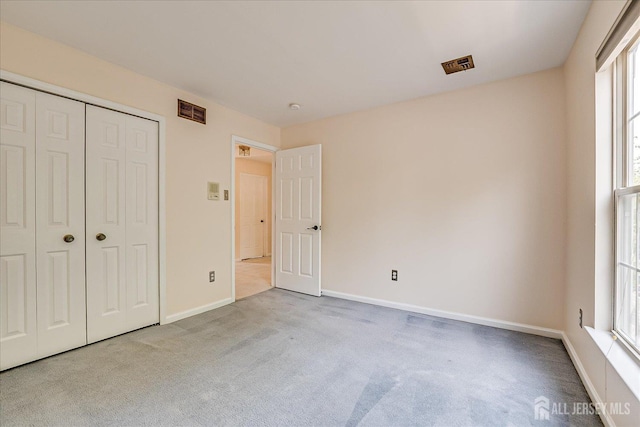2 Durham Way E, Windsor, NJ 08520 - unfurnished bedroom featuring carpet, multiple windows, baseboards, and a closet