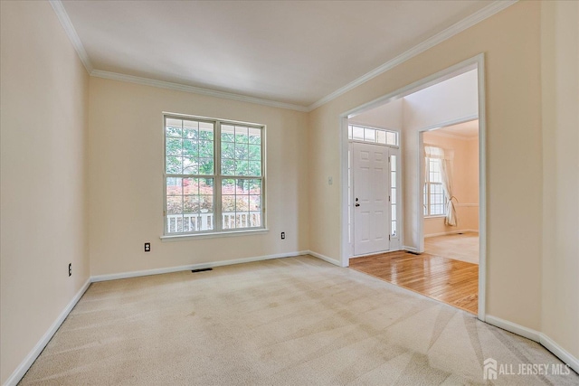 2 Durham Way E, Windsor, NJ 08520 - carpeted entryway featuring crown molding, plenty of natural light, and baseboards