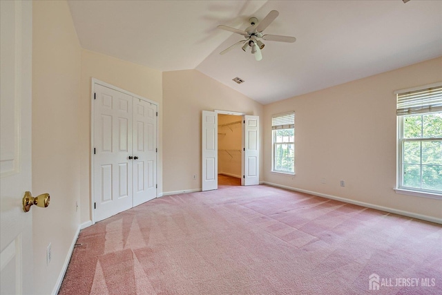 2 Durham Way E, Windsor, NJ 08520 - unfurnished bedroom featuring multiple windows, light carpet, baseboards, lofted ceiling, and ceiling fan