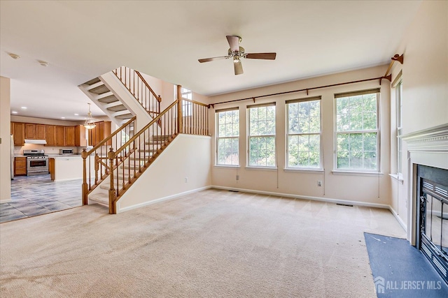 2 Durham Way E, Windsor, NJ 08520 - unfurnished living room with stairs, ceiling fan, light carpet, a fireplace with flush hearth, and recessed lighting