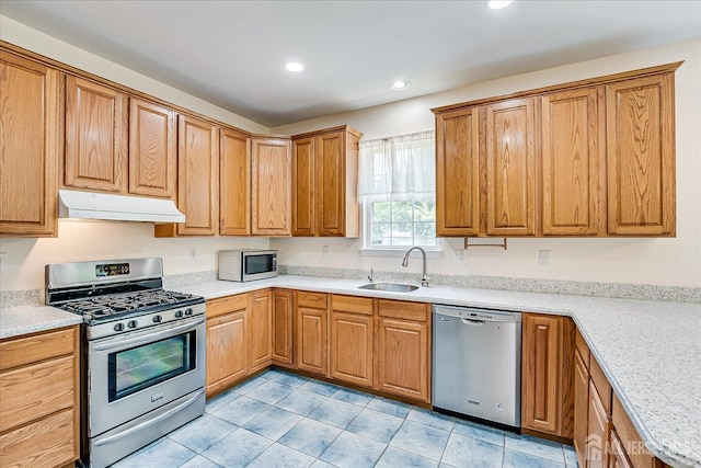2 Durham Way E, Windsor, NJ 08520 - kitchen featuring appliances with stainless steel finishes, under cabinet range hood, a sink, recessed lighting, and light countertops