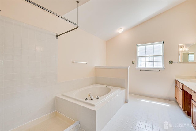 2 Durham Way E, Windsor, NJ 08520 - bathroom featuring vanity, a garden tub, vaulted ceiling, and tile patterned flooring