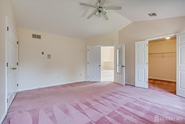 2 Durham Way E, Windsor, NJ 08520 - unfurnished bedroom with light carpet, vaulted ceiling, baseboards, and a walk in closet