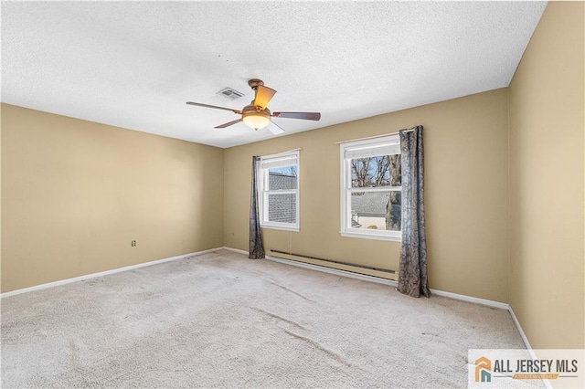 spare room with a baseboard radiator, a ceiling fan, carpet, a textured ceiling, and baseboards