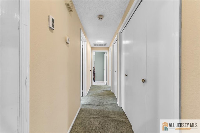 532 Old Nassau Rd Unit 532N, Monroe, NJ 08831 - corridor featuring carpet floors and a textured ceiling
