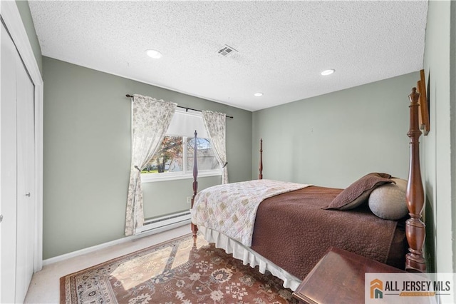 bedroom with carpet flooring, a textured ceiling, a closet, recessed lighting, and baseboards