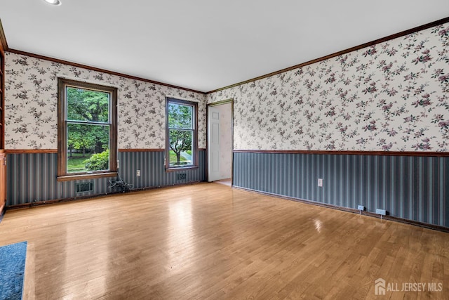 21 Shadyside Ct, Branchburg, NJ 08876 - unfurnished room featuring wood finished floors, crown molding, wallpapered walls, and a wainscoted wall