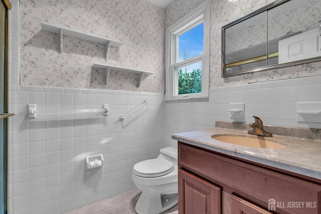 21 Shadyside Ct, Branchburg, NJ 08876 - full bath featuring wallpapered walls, tile walls, tile patterned flooring, vanity, and wainscoting