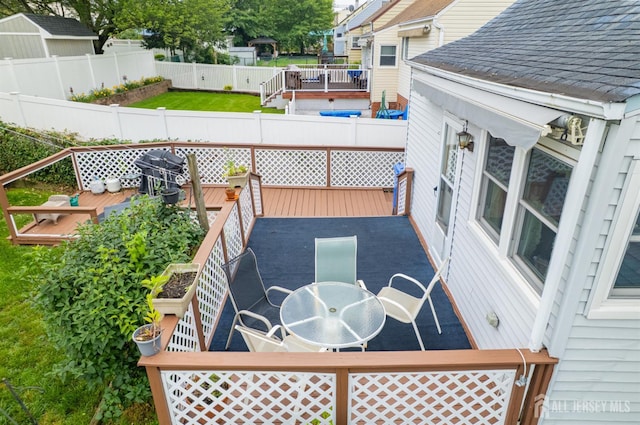 58 Hudson St, Menlo Park Terrace, NJ 08840 - wooden deck with outdoor dining space, a fenced backyard, and grilling area
