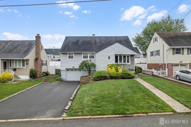 58 Hudson St, Menlo Park Terrace, NJ 08840 - view of front of house featuring an attached garage, asphalt driveway, and a residential view
