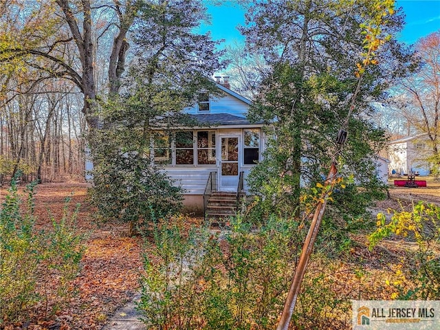 view of front facade featuring a sunroom