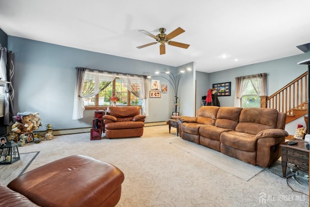 carpeted living room with ceiling fan, a baseboard radiator, and a wealth of natural light