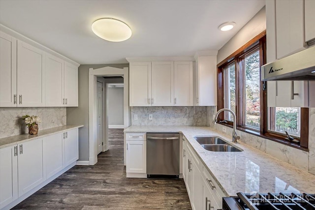 kitchen with dark wood-style flooring, a sink, white cabinets, stainless steel dishwasher, and light stone countertops