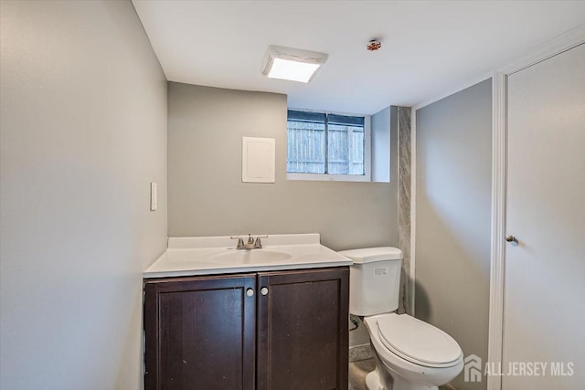 bathroom with toilet and vanity