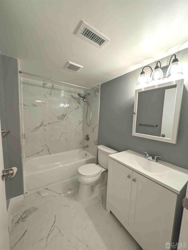 full bathroom with vanity, a textured ceiling, toilet, and tiled shower / bath