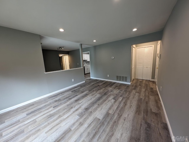 unfurnished living room with light hardwood / wood-style flooring