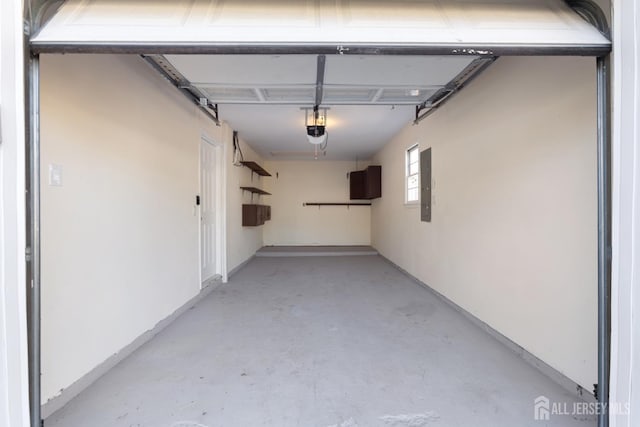 garage with electric panel and a garage door opener