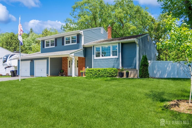 4 Wedgewood Ct, East Brunswick, NJ 08816 - split level home featuring a chimney, a garage, and concrete driveway