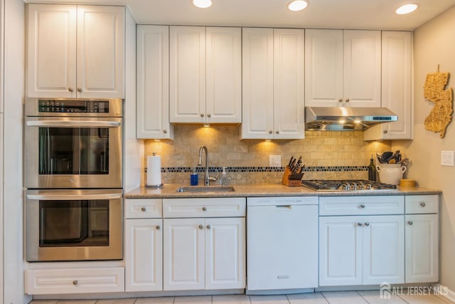 4 Wedgewood Ct, East Brunswick, NJ 08816 - kitchen featuring stainless steel appliances, under cabinet range hood, a sink, white cabinets, and recessed lighting