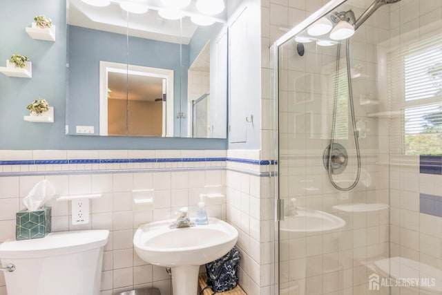 4 Wedgewood Ct, East Brunswick, NJ 08816 - bathroom featuring toilet, a stall shower, tile walls, and wainscoting