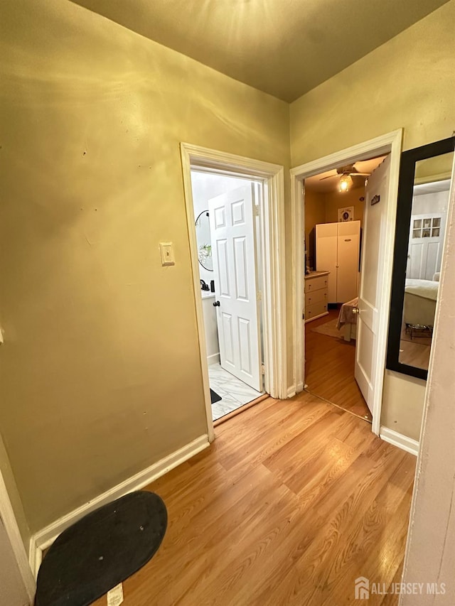 7 Hazelhurst St, New Brunswick, NJ 08901 - corridor featuring light wood-type flooring and baseboards