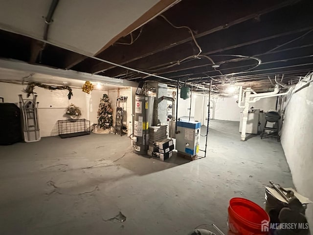 7 Hazelhurst St, New Brunswick, NJ 08901 - unfinished basement featuring gas water heater and washer / dryer