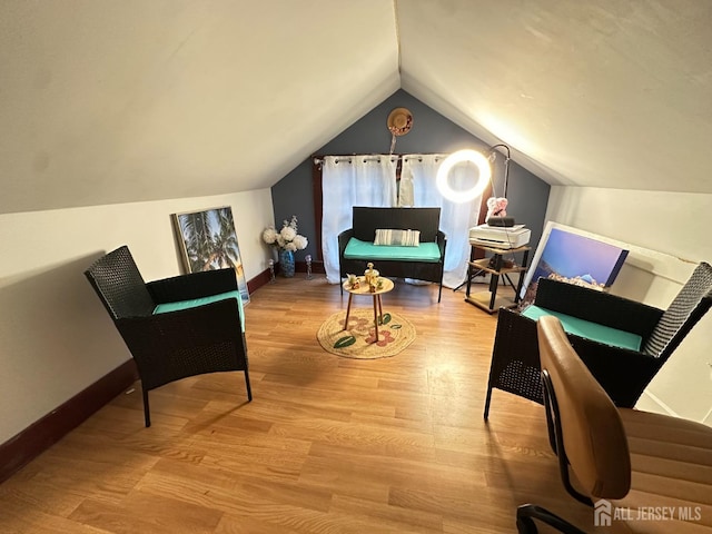 7 Hazelhurst St, New Brunswick, NJ 08901 - sitting room featuring light wood-style floors, lofted ceiling, and baseboards