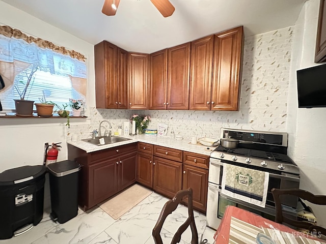 7 Hazelhurst St, New Brunswick, NJ 08901 - kitchen with double oven range, a sink, light marble finish flooring, light countertops, and ceiling fan