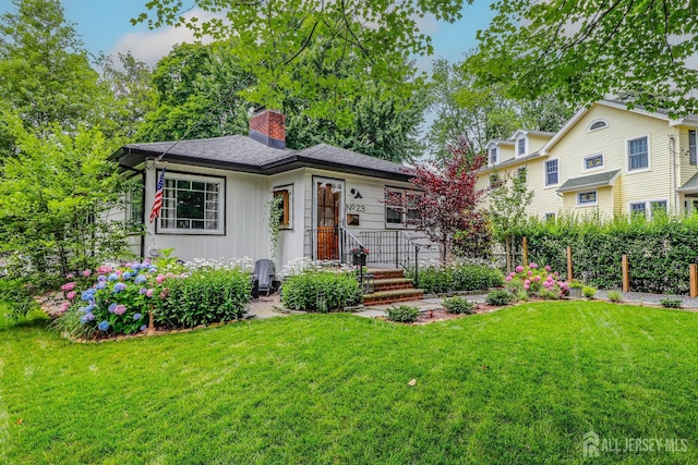 23 Elm Ave, Metuchen, NJ 08840 - view of front of property with a front yard and a chimney