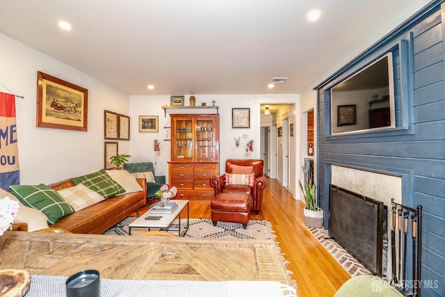 23 Elm Ave, Metuchen, NJ 08840 - living room with light wood-type flooring, a fireplace with flush hearth, and recessed lighting
