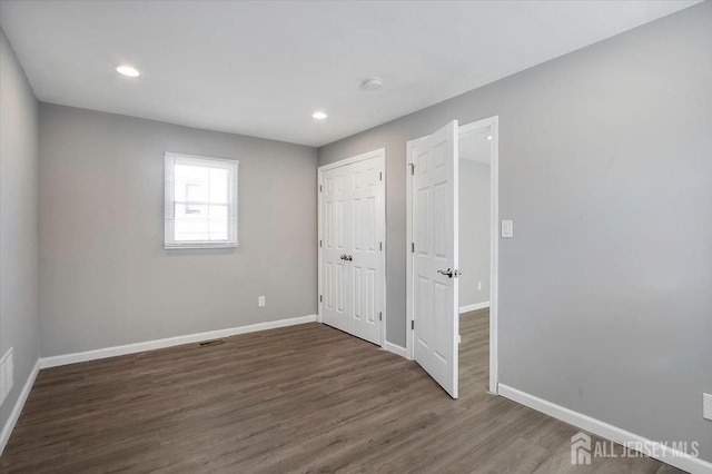 15 Douglas St, Sayreville, NJ 08872 - unfurnished bedroom with baseboards, wood finished floors, and recessed lighting