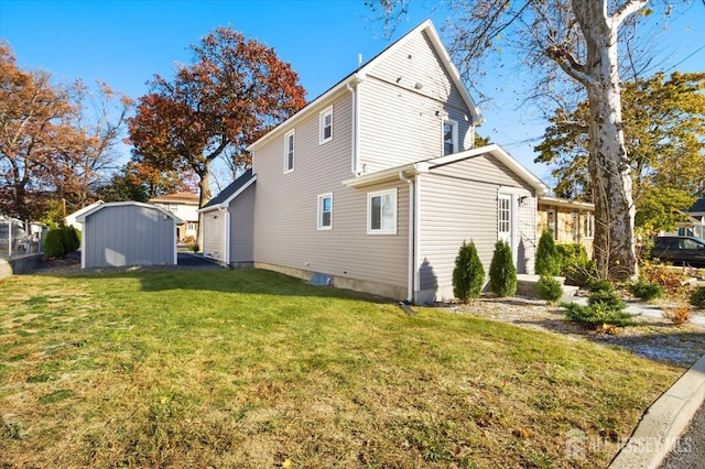 15 Douglas St, Sayreville, NJ 08872 - view of property exterior with a yard, a storage unit, and an outbuilding