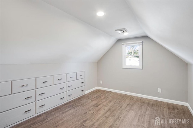 15 Douglas St, Sayreville, NJ 08872 - bonus room featuring wood finished floors, vaulted ceiling, and baseboards