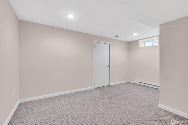 spare room with visible vents, baseboards, baseboard heating, carpet floors, and recessed lighting