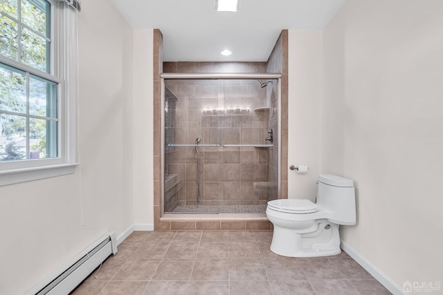 bathroom with a stall shower, a baseboard radiator, baseboards, and toilet