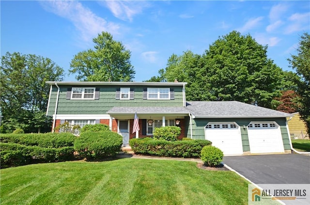 20 Rath Ln, East Brunswick, NJ 08816 - traditional home featuring driveway, a front lawn, and an attached garage