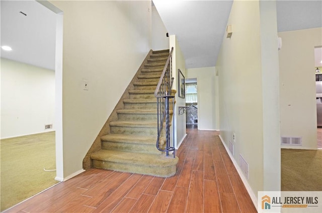 20 Rath Ln, East Brunswick, NJ 08816 - staircase featuring wood finished floors and carpet flooring