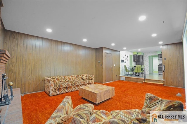 20 Rath Ln, East Brunswick, NJ 08816 - living room featuring carpet, wooden walls, and recessed lighting